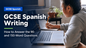GCSE Spanish student writing notes beside a laptop while preparing a 90- or 150-word answer